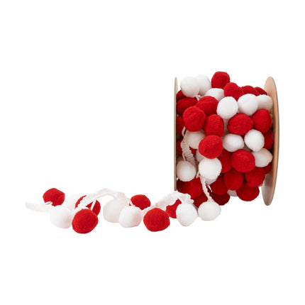 1" red-and-white fluffy pom pom trim, partially unrolled on spool