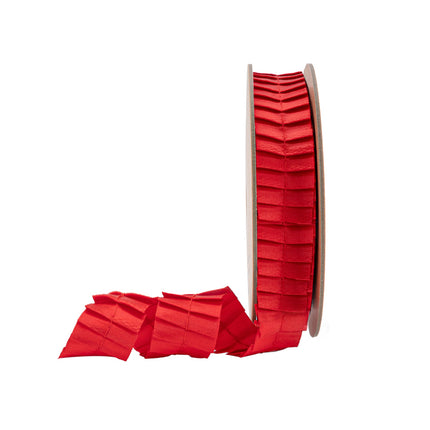 1" vibrant red pleated ribbon, partially unrolled on spool