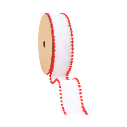 A spool of white ribbon adorned with red pom-pom detailing, a charming choice for creative crafts.