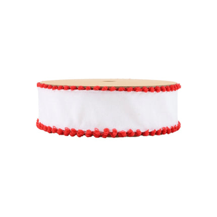 A spool of ornamental ribbon with a white background and red pom-pom edges, ideal for DIY projects.