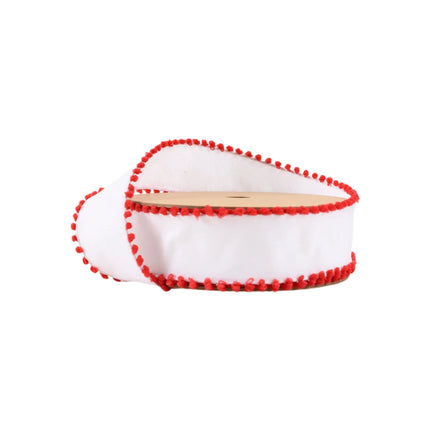 A spool of white ribbon with red pom-pom trim, featuring a playful and festive design ideal for holiday crafts.