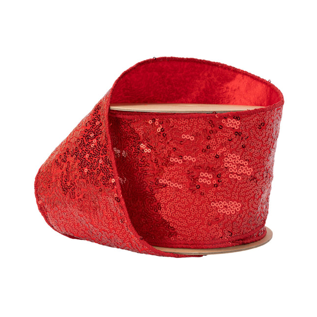 A spool of wired ribbon adorned with red scattered sequins, perfect for crafts and decorations.
