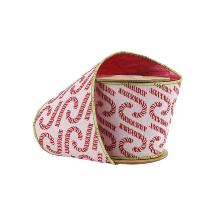 A spool of pink ribbon with red candy cane patterns and green edging, perfect for Christmas decorating and gift wrapping.