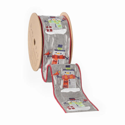 A reel of ribbon is adorned with embroidered snowmen in various colors on a gray background, along with red edge stitching.
