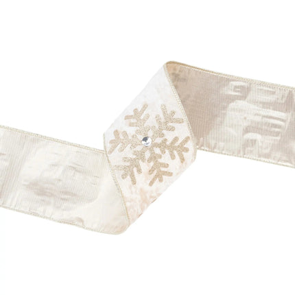 A curled piece of 4" wired velvet ribbon in champagne, featuring glitter gold snowflakes with jewels, showing both front and back textures and designs.