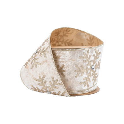 A roll of 4" wired velvet Christmas ribbon in champagne, adorned with glittering gold snowflakes and jewel accents, offering a luxurious festive look.