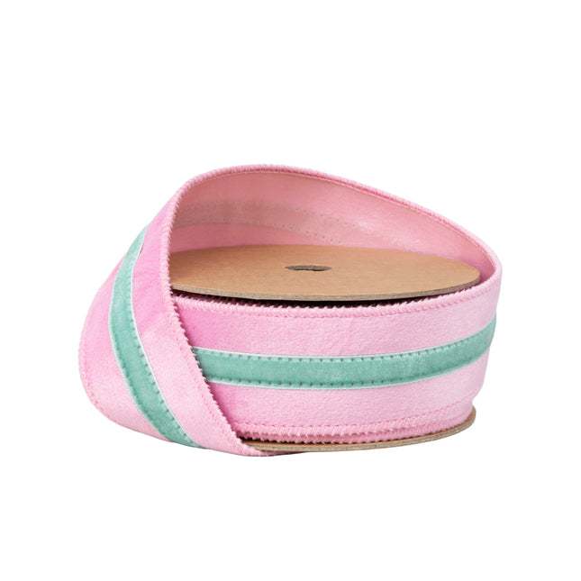 1.5" wired pink velvet ribbon with mint trim, partially unspooled from spool.