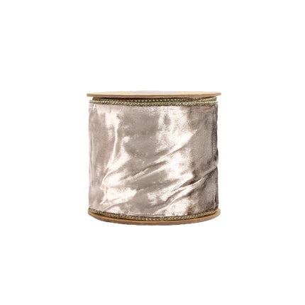A spool holds a reversible metallic gold velvet ribbon with gold stitching, ideal for elevating luxurious holiday decorations.
