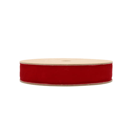 Scarlet velvet ribbon spool: rich plush red fabric – perfect for festive decor & crafting.