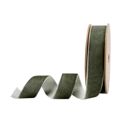 Olive green velvet ribbon on a brown spool, perfect for crafting elegant bows for harvest wreaths, bringing a warm, rustic vibe to events.