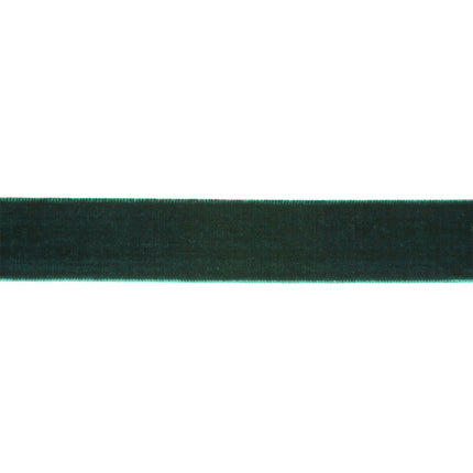Dark green velvet ribbon on a brown spool, perfect for Christmas decor and creating upscale party favor ties with its rich, elegant finish.