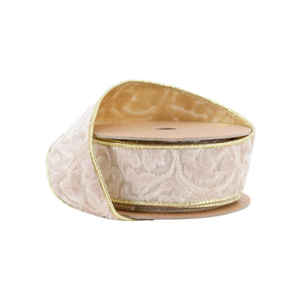 A roll of 1 1/2" wired velvet ribbon, ivory with floral embossing, gold backing and trim, offering a luxurious texture for festive decor and crafting.
