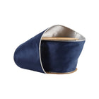 A spool of reversible velvet wired ribbon features navy on one side and silver on the reverse, ideal for decorative projects.