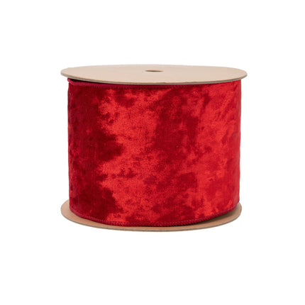 This spool presents a red wired velvet ribbon, ideal for dynamic decorative styling.