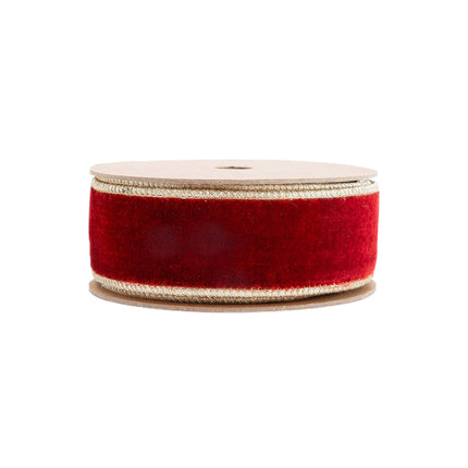 Spooled red velvet ribbon with gold edges, suitable for luxurious holiday decor, gift wrapping, and creative crafting endeavors.