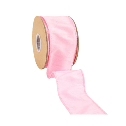 Pink wired dupioni ribbon, unrolled from spool, soft textured fabric & stitched edges.
