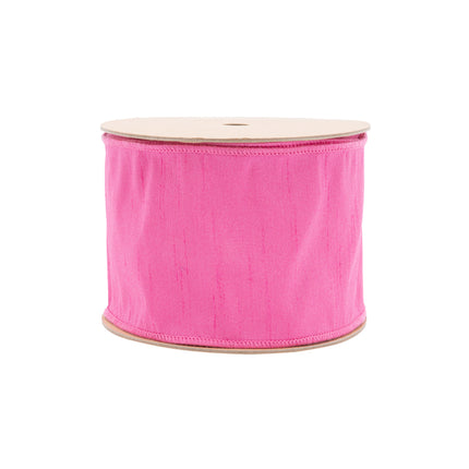 Spool of hot pink linen wired ribbon for spring craft projects.