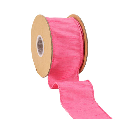 Hot Pink wired dupioni ribbon, unrolled from spool, woven textured fabric.