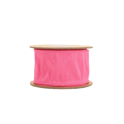 Full spool of hot pink wired dupioni ribbon, woven texture & stitched edges.