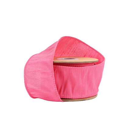 Hot Pink wired dupioni ribbon on spool, textured fabric & neat stitched edges.