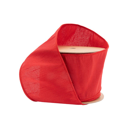 4" red wired dupioni ribbon, ideal for Christmas decor, crafting, and gift wrapping with its textured, luxurious sheen.

