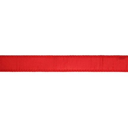 The red ribbon, characterized by its stitched borders and textured material.