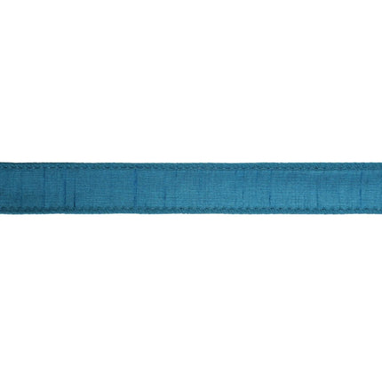 Teal textured fabric ribbon with neat stitching, excellent for holiday ambiance, gift presentation.