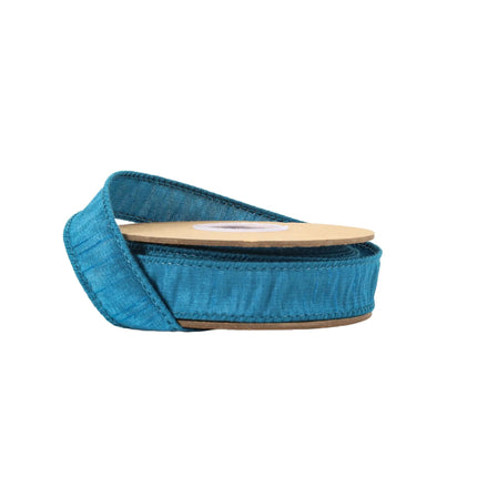 Teal fabric ribbon spool with textured weave —a versatile choice for adding a chic touch to creative embellishments.
