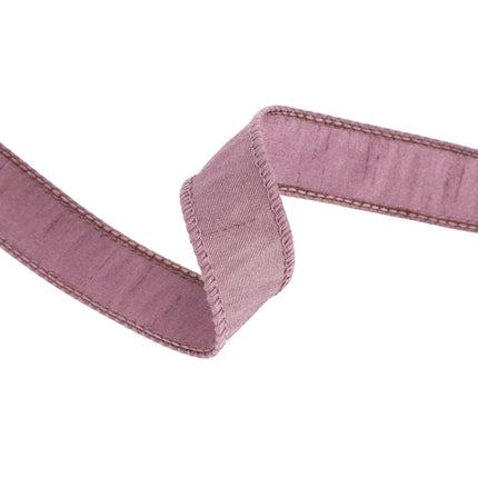 A length of purple ribbon is characterized by its soft, textured appearance, gentle hue, designed for decor applications.