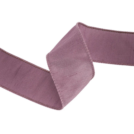 This purple ribbon is characterized by its gentle, wrinkled appearance, soothing mauve tone, perfect for festive home decor.