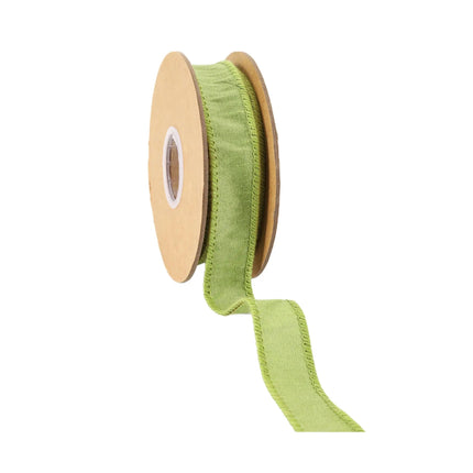 A reel of light green ribbon has a distinctive fabric texture with a hint of understated depth, suitable for crafting stylish.