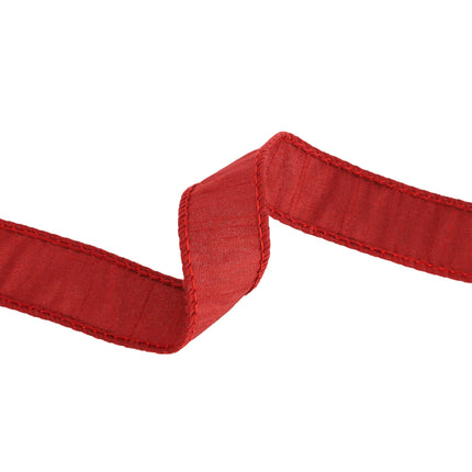 Red ribbon with neat stitching, flexible fabric, showcases exquisite craftsmanship and rich color.