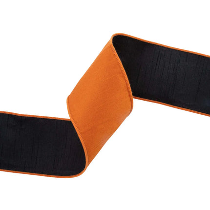 Textured orange double-sided dupioni ribbon with black lining, perfect for pumpkin gift wrapping