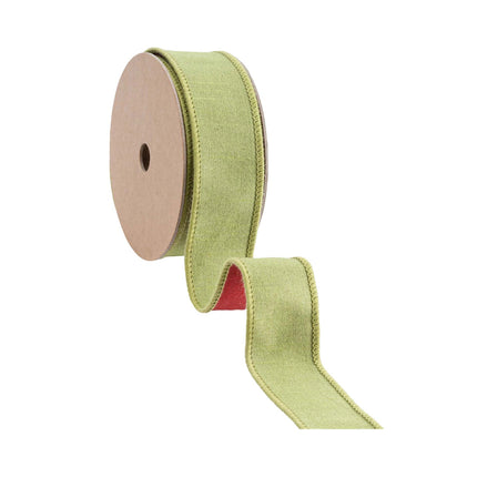 A roll of wired green ribbon with a red backing, great for creating earthy, seasonal accents and decorative crafts.