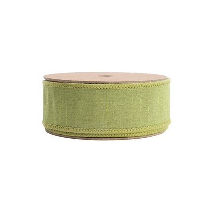 Spooled reversible green textured ribbon with a red reverse, ideal for elevating rustic and seasonal decorations.