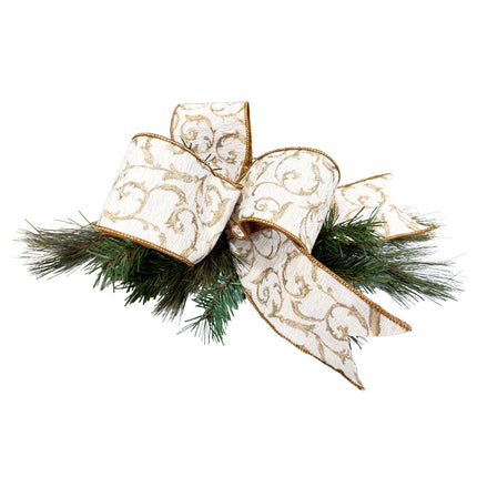 Bow with white base & gold Baroque scrolls, paired with green pine needles, festive Christmas decor.
