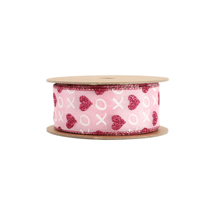 Pink wired ribbon spool: red glitter hearts, white XO patterns, bright red trimmed edges.