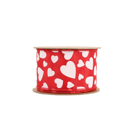 Red wired ribbon spool; multi-size white hearts, neatly rolled.