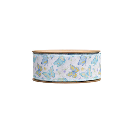 Spool of butterfly print wired ribbon for cheerful spring craft projects.