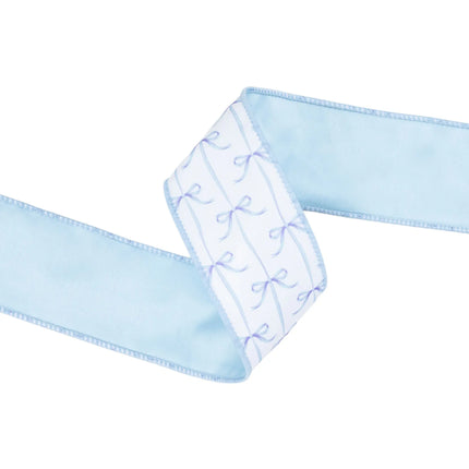 2 1/2" Wired Dupioni Ribbon, blue bows on white with blue backing, adds a whimsical touch to table settings.
