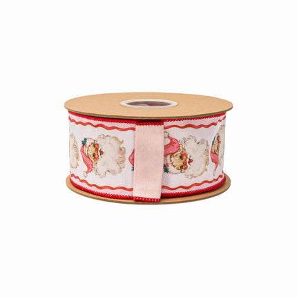 2 1/2" retro pink Santa dupioni ribbon, cream base with charming Santa motifs and wavy red accents, paired with a matching pink backing