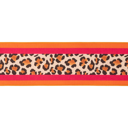 Stylish mixed‑print ribbon, dupioni fabric combining animal print and bright stripes with pink backing for modern decor