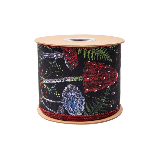 Black wired ribbon with vibrant jewel‑hued mushroom print, featuring forest foliage accents with red reverse