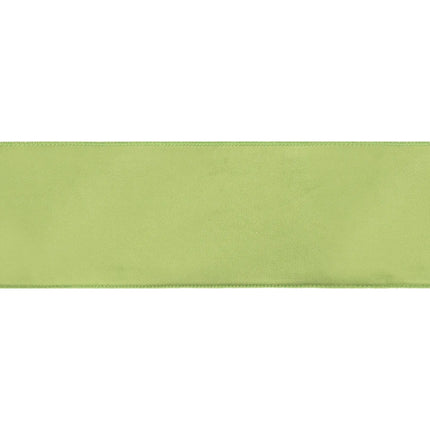 4-inch solid lime velvet wired ribbon with bright fuchsia backing, great for whimsical holiday ornament making.