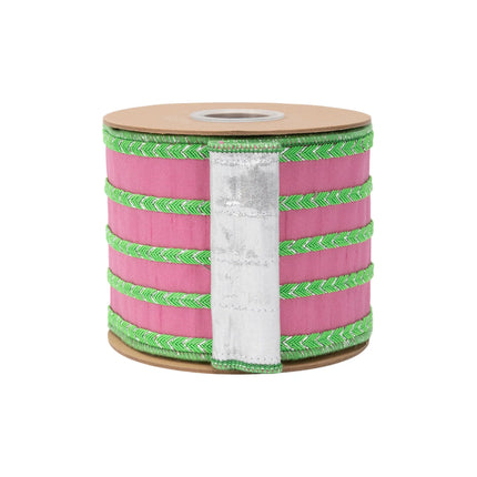 Wide pink dupioni wired ribbon, featuring multi-row green braided detailing and reflective metallic reverse side