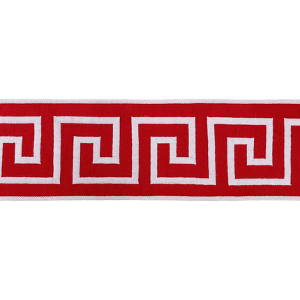 4-inch wide wired red ribbon with raised white Greek key embroidery for seasonal gift wrapping accents.