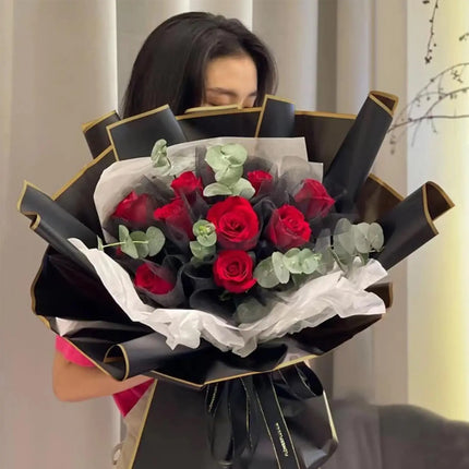Stunning large red rose bouquet wrapped in 58x58cm Black Matte Floral Sheets with Gold Edge
