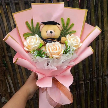 Graduation bouquet with plush teddy bear and artificial roses, wrapped in Wild Rose Matte Floral Sheets with Gold Edge