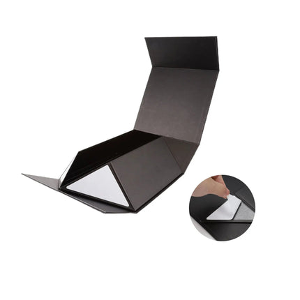 Black gift box with folding structure, solid black, adhesive detail, unique design.