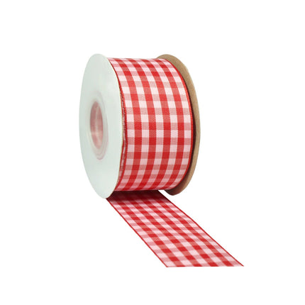 Red/pink gingham check ribbon spool, woven texture, partial ribbon unfurled for decor.